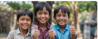 Three children giving a thumbs up, supported by CareHub donors